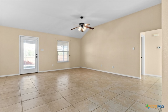 unfurnished room featuring ceiling fan, light tile patterned floors, and vaulted ceiling