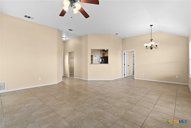 unfurnished living room with ceiling fan with notable chandelier, light tile patterned floors, and vaulted ceiling