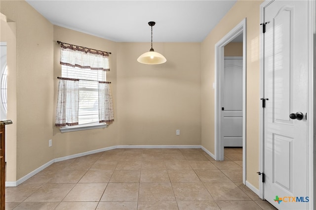 spare room with light tile patterned flooring