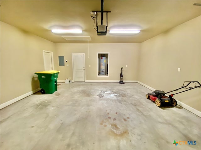 garage featuring electric panel, a garage door opener, and water heater