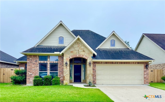 view of front of house with a garage and a front yard