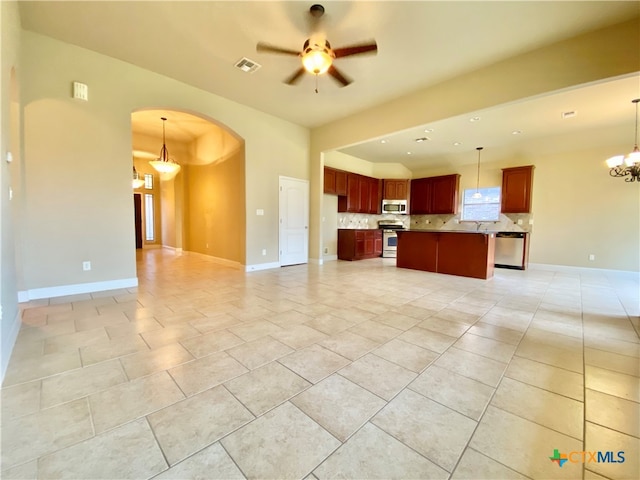 unfurnished living room with sink and ceiling fan with notable chandelier