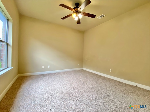 empty room with carpet flooring and ceiling fan