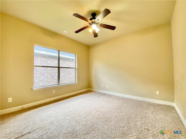 empty room with carpet flooring and ceiling fan