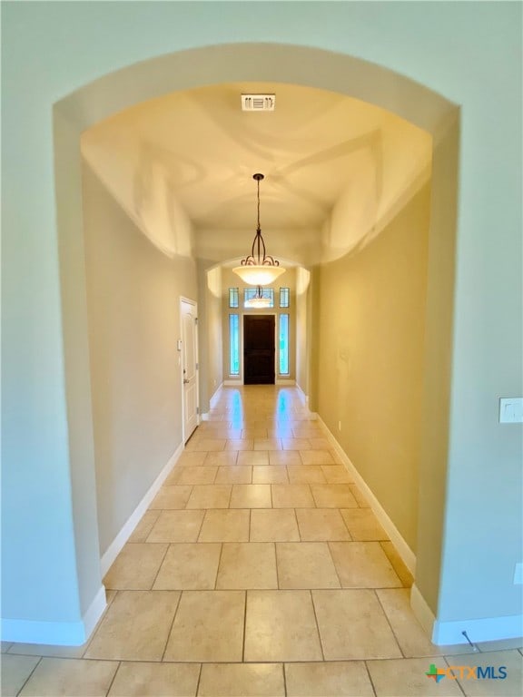 corridor with light tile patterned flooring