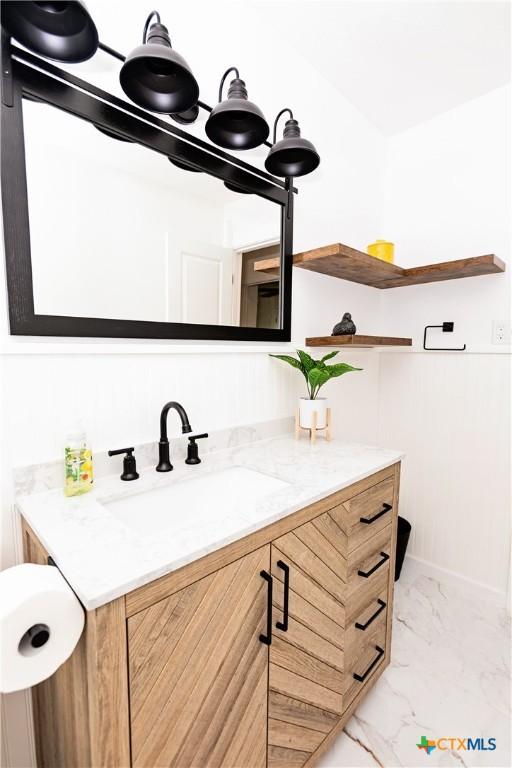 2111 Brantley Ave, Copperas Cove, TX 76522 - bathroom featuring marble look tiles and vanity