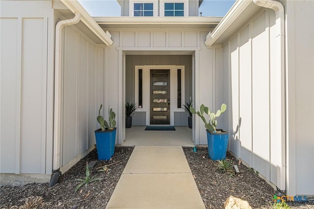 doorway to property featuring board and batten siding