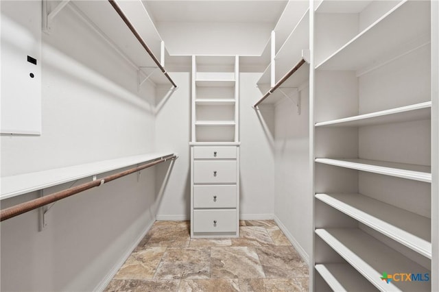5905 Turtle Creek Trl, Temple, TX 76502 - walk in closet with light stone finish floors
