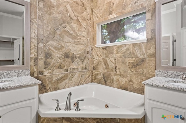 5905 Turtle Creek Trl, Temple, TX 76502 - full bath with two vanities, a whirlpool tub, and ornamental molding