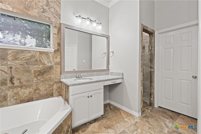 5905 Turtle Creek Trl, Temple, TX 76502 - bathroom featuring a bath, vanity, crown molding, a shower stall, and baseboards