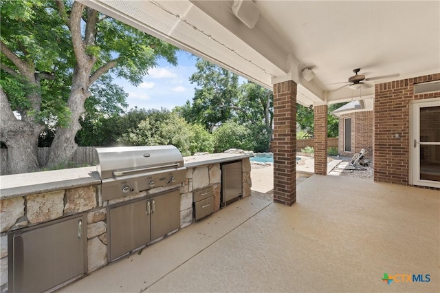 5905 Turtle Creek Trl, Temple, TX 76502 - view of patio with exterior kitchen and ceiling fan