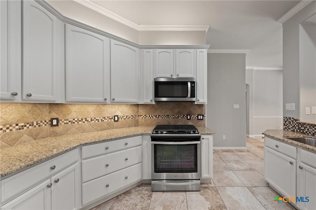 5905 Turtle Creek Trl, Temple, TX 76502 - kitchen featuring stainless steel appliances, tasteful backsplash, light stone countertops, and ornamental molding
