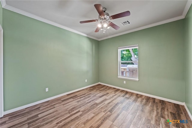 5905 Turtle Creek Trl, Temple, TX 76502 - unfurnished room with ceiling fan, baseboards, wood finished floors, and crown molding