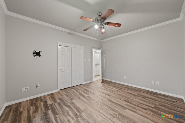 5905 Turtle Creek Trl, Temple, TX 76502 - unfurnished bedroom featuring wood finished floors, baseboards, crown molding, a closet, and a ceiling fan