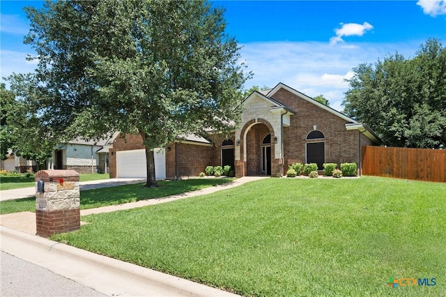 5905 Turtle Creek Trl, Temple, TX 76502 - view of front of home featuring brick siding, concrete driveway, and a garage