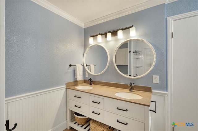 1506 Spiderlily Vw, Cedar Park, TX 78613 - full bath with double vanity, crown molding, a wainscoted wall, a textured wall, and a decorative wall