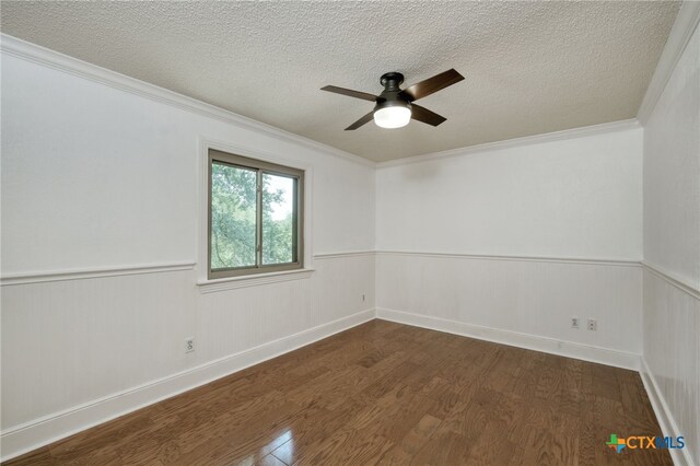 1506 Spiderlily Vw, Cedar Park, TX 78613 - unfurnished room with dark wood-style flooring, a textured ceiling, a wainscoted wall, ceiling fan, and ornamental molding