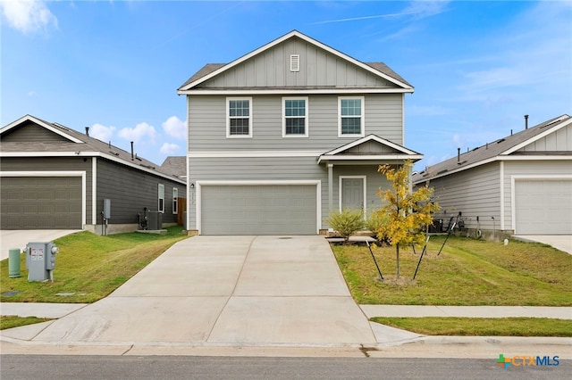 view of front property featuring a garage and a front yard