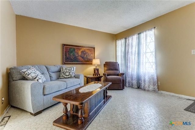 living room with a textured ceiling