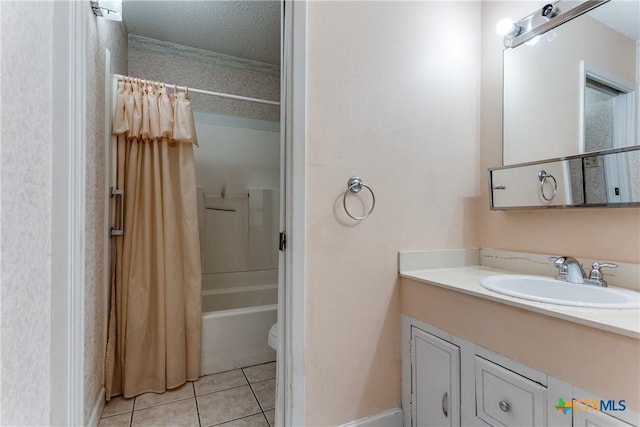 full bathroom with shower / tub combo with curtain, tile patterned flooring, vanity, a textured ceiling, and toilet