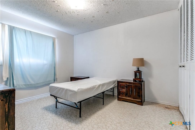 bedroom with a textured ceiling