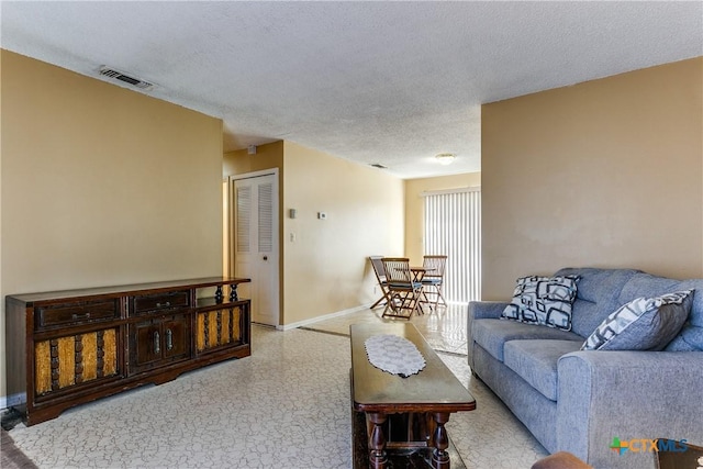 living room with a textured ceiling