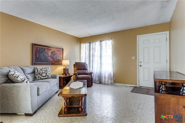 living room featuring a textured ceiling