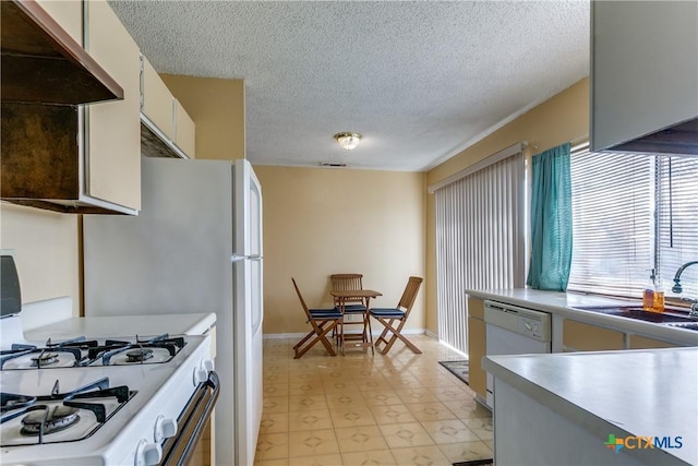 kitchen with sink, white appliances, ventilation hood, a textured ceiling, and white cabinets