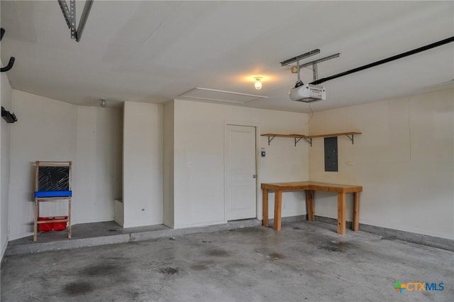5832 Alexandria Dr, Temple, TX 76502 - garage featuring electric panel, a garage door opener, and baseboards