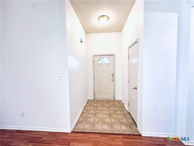 entryway with hardwood / wood-style floors