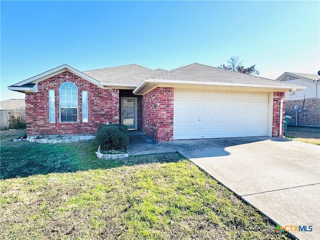 ranch-style home with a garage and a front lawn