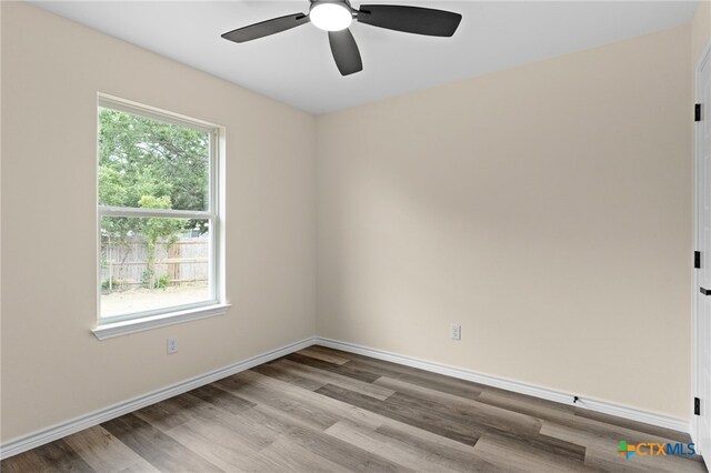 5224 Rose Garden Loop, Killeen, TX 76542 - unfurnished room featuring wood finished floors, a ceiling fan, and baseboards