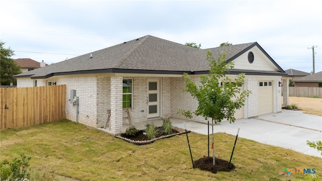 5224 Rose Garden Loop, Killeen, TX 76542 - view of property exterior featuring roof with shingles, brick siding, a garage, and concrete driveway