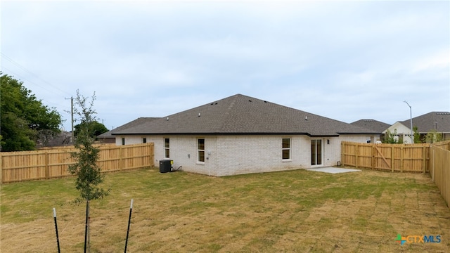 5224 Rose Garden Loop, Killeen, TX 76542 - back of house featuring brick siding, central AC, a shingled roof, and a patio area