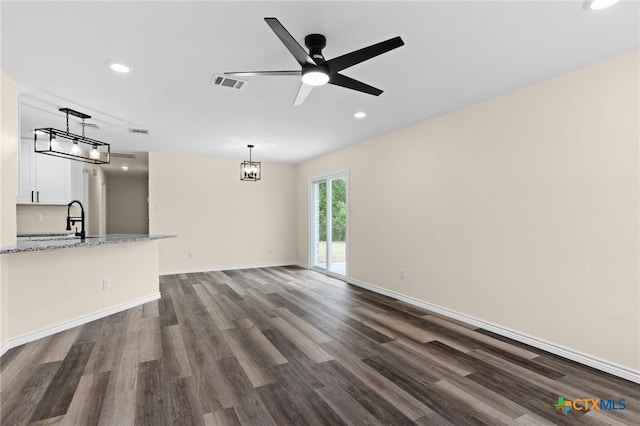 5224 Rose Garden Loop, Killeen, TX 76542 - unfurnished living room featuring dark wood finished floors, recessed lighting, baseboards, a sink, and ceiling fan