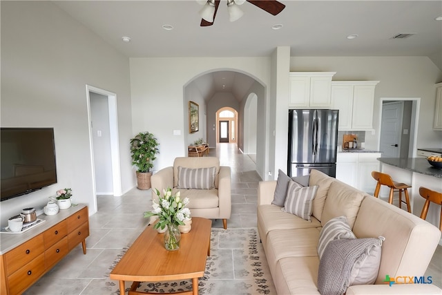 313 Durata Dr, San Marcos, TX 78666 - living area with arched walkways, vaulted ceiling, ceiling fan, light tile patterned flooring, and recessed lighting
