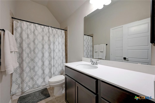 bathroom featuring vanity, tile patterned floors, toilet, and lofted ceiling