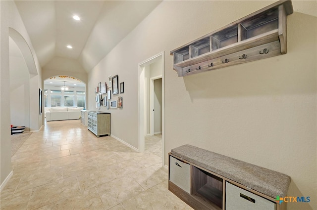 mudroom featuring vaulted ceiling