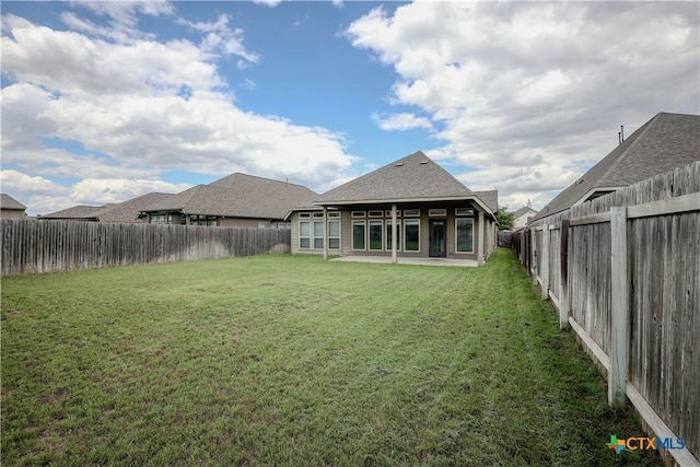 313 Durata Dr, San Marcos, TX 78666 - back of property featuring roof with shingles and a patio area