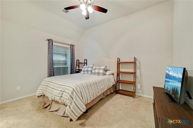 bedroom featuring light carpet, ceiling fan, and vaulted ceiling