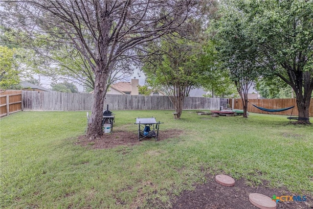 view of yard featuring a fenced backyard