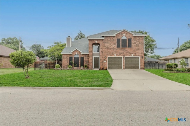 traditional-style home with fence, a front lawn, a garage, a chimney, and concrete driveway
