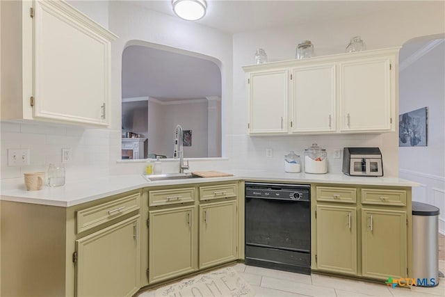 kitchen with ornamental molding, black dishwasher, light countertops, tasteful backsplash, and a sink