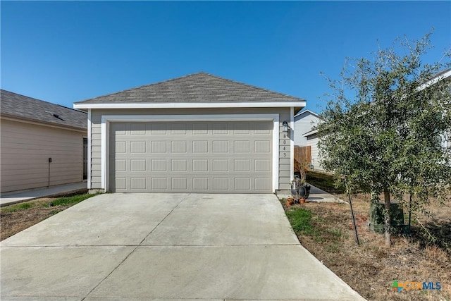 view of front of home featuring a garage and an outdoor structure