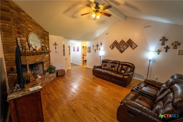 308 Fernwood Cir, Victoria, TX 77901 - living room featuring ceiling fan, wood finished floors, baseboards, and a brick fireplace