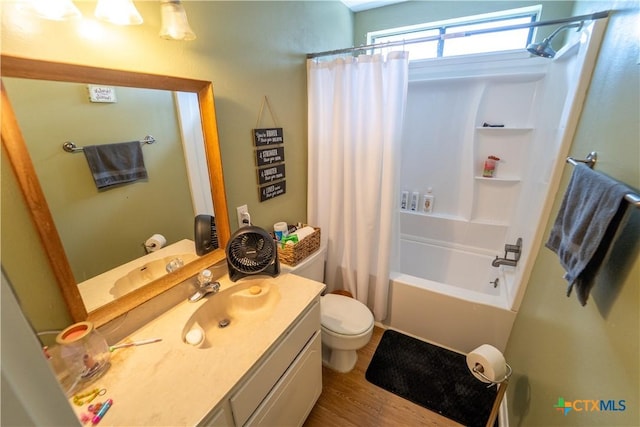 308 Fernwood Cir, Victoria, TX 77901 - bathroom with toilet, vanity, shower / bathtub combination with curtain, and wood finished floors