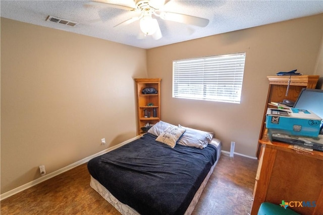 308 Fernwood Cir, Victoria, TX 77901 - bedroom with a textured ceiling, carpet, and ceiling fan