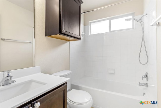 bathroom with vanity, toilet, and shower / bath combination