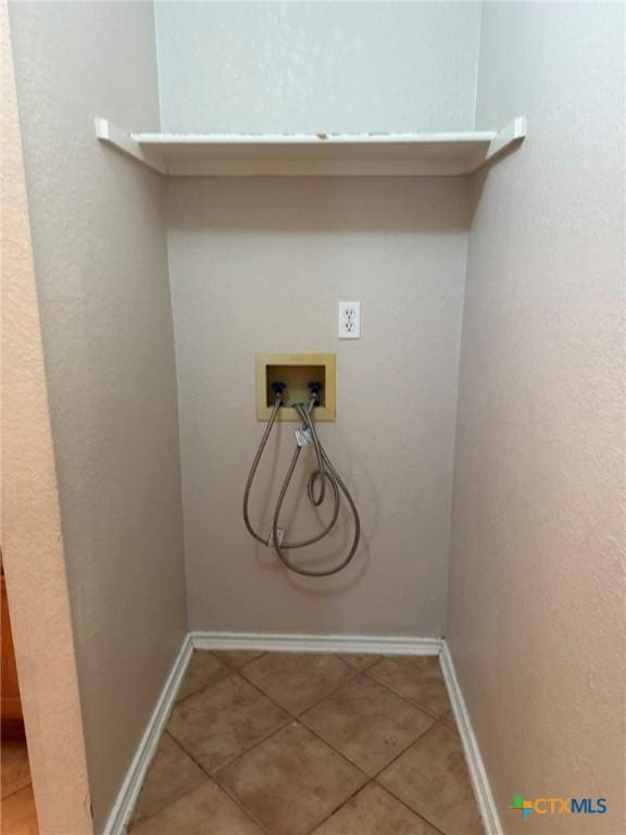 2301 Flintstone Cir, Killeen, TX 76543 - laundry room featuring light tile patterned flooring and washer hookup