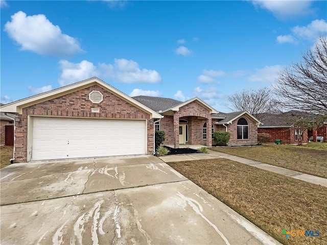 ranch-style home with a garage and a front yard